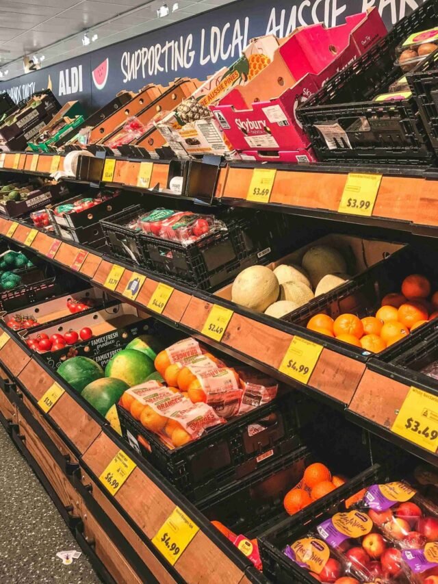 Photo by Capitalist Money on June 16, 2024. May be an image of A photograph of rows of fresh produce in a grocery store. There are oranges, grapes, nectarines, watermelon, pineapple, and other fruits displayed. The image may contain text such as 'SUPPORTING LOCAL AUSSIE', 'ALDI', 'FAMILY FRESH', 'FAMILY FRESH', 'AUSSIE PINES'.