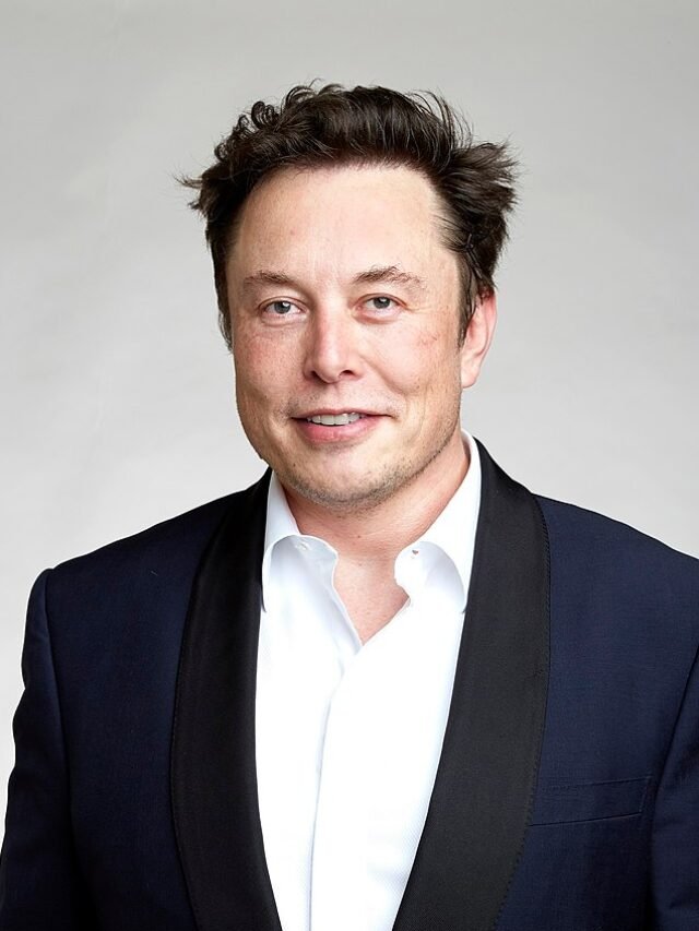 Photo by Capitalist Money on June 03, 2024. May be an image of Headshot of Elon Musk in a black suit jacket and white collared shirt, smiling at the camera. .