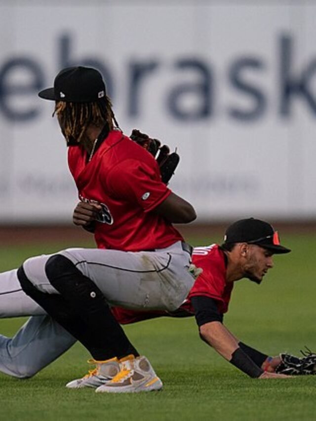 Photo by Capitalist Money on June 04, 2024. May be an image of Two baseball players performing an acrobatic double play in a game. The image may contain text such as 'ebrask'.