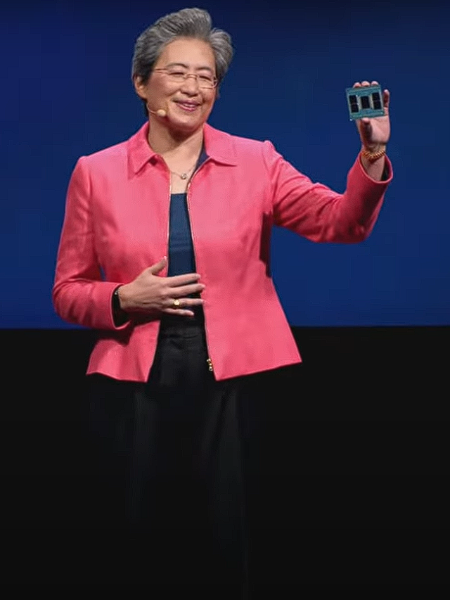 Photo by Capitalist Money on June 03, 2024. May be an image of A woman in a pink blazer stands on a stage, holding a small, rectangular object in her hand and smiling. .