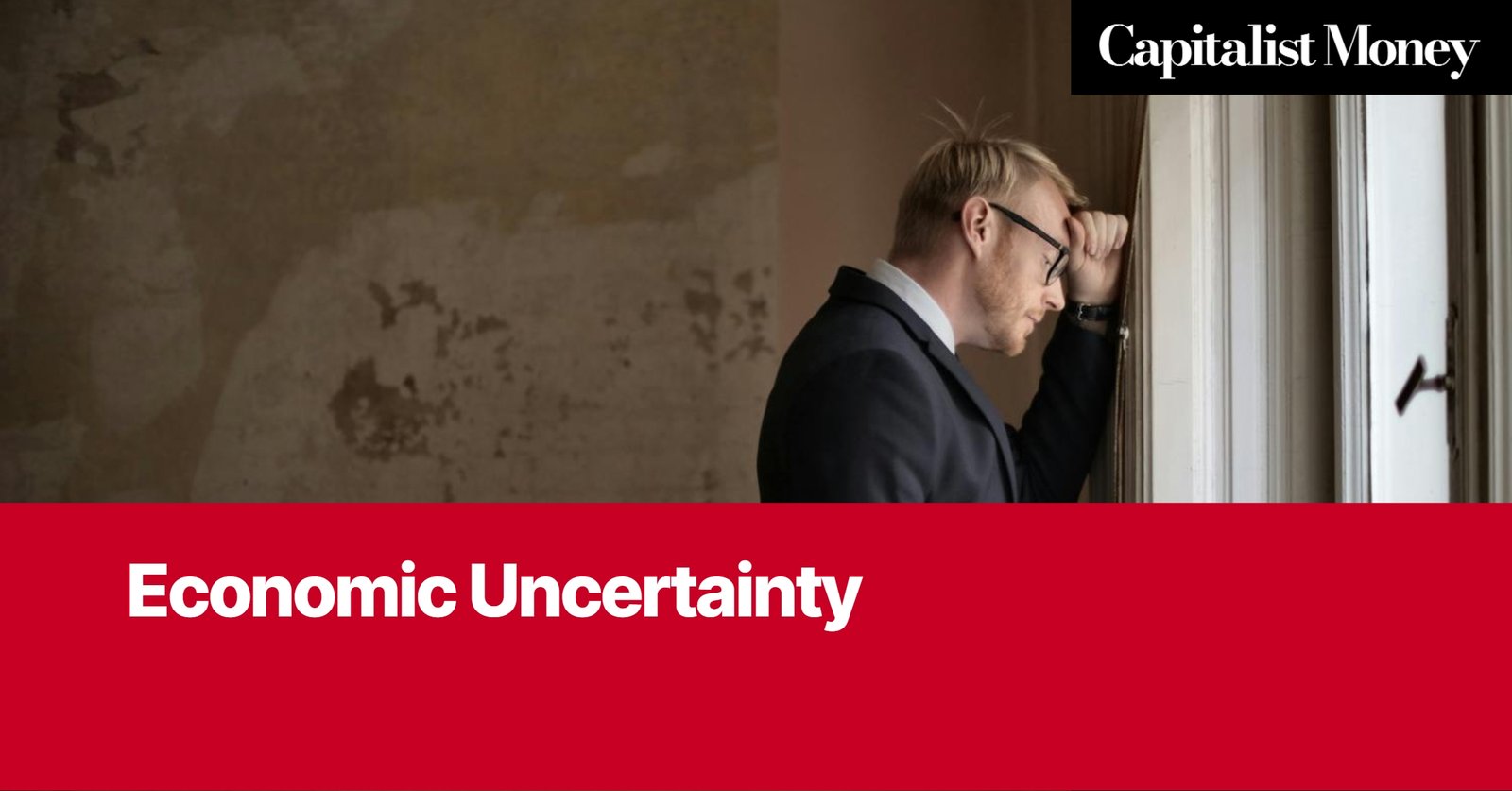 Photo by Capitalist Money on August 06, 2024. May be an image of A man in a suit is leaning his head against a window with a look of worry on his face. The image has a red banner at the bottom with the words 'Economic Uncertainty' in white text. The image may contain text such as 'Capitalist Money', 'Economic Uncertainty'.