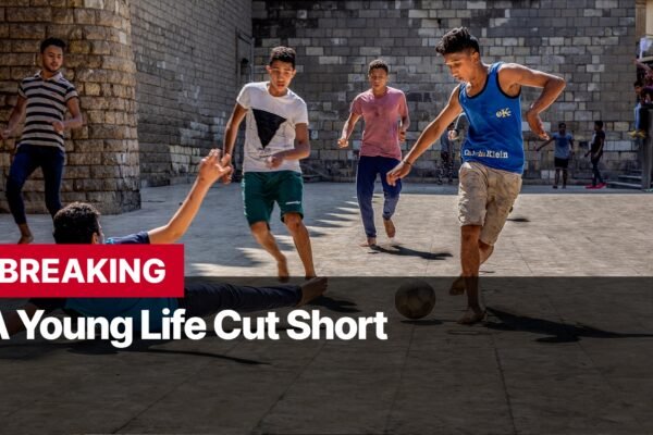 Photo by Capitalist Money on August 27, 2024. May be an image of A young boy lies on the ground with his arm outstretched as he plays a game of street football with his friends. The image may contain text such as 'BREAKING', 'A Young Life Cut Short'.