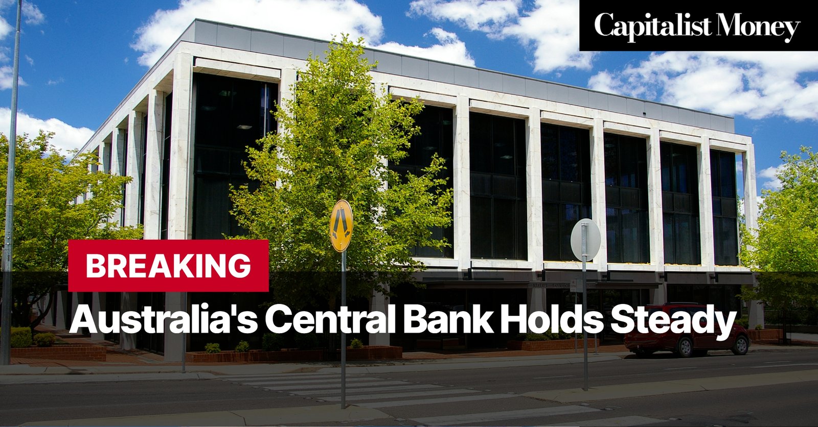 Photo by Capitalist Money on August 06, 2024. May be an image of A photo of the Reserve Bank of Australia building in Canberra, taken from across the street. The sky is blue and there are a few clouds. The image may contain text such as 'Capitalist Money', 'BREAKING', 'Australia's Central Bank Holds Steady'.