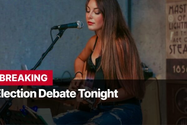 Photo by Capitalist Money on September 11, 2024. May be an image of A woman sings into a microphone while playing a guitar. The words "Breaking Election Debate Tonight" are overlaid in the bottom right of the image. The image may contain text such as 'BREAKING Election Debate Tonight', 'MASTER OF LIGHTNING IN THE AGE OF STEAM 1856'.