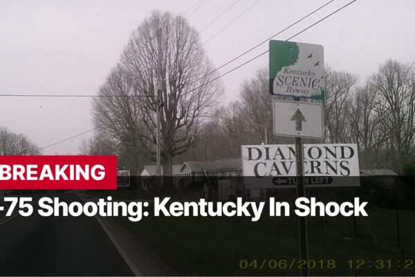 Photo by Capitalist Money on September 08, 2024. May be an image of A photo of a road sign that says "Diamond Caverns" with a "Kentucky Scenic Byway" sign above it. There is a black and white title that reads "Breaking I-75 Shooting: Kentucky In Shock" and the date 04/06/2018 is displayed at the bottom. The image may contain text such as 'BREAKING I-75 Shooting: Kentucky In Shock 04/06/2018 12:31:23 Kentucky Scenic Byway Diamond Caverns Turn Left'.