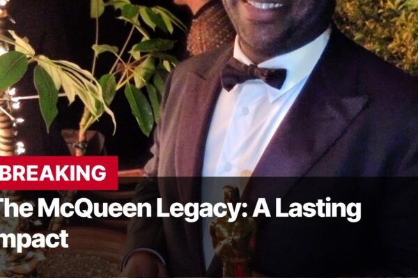 Photo by Capitalist Money on September 14, 2024. May be an image of A man in a tuxedo smiles as he holds an award, with plants and string lights behind him. The words "BREAKING" and "The McQueen Legacy: A Lasting Impact" are written across the bottom. The image may contain text such as 'BREAKING', 'The McQueen Legacy: A Lasting Impact'.