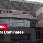 Photo by Capitalist Money on September 08, 2024. May be an image of The image shows the exterior of a large stadium, with the words "BREAKING: Alabama Dominates" in bold, red letters. There are people in the stands, and the stadium is decorated with the team's colors. The image may contain text such as 'BREAKING', 'Alabama Dominates'.