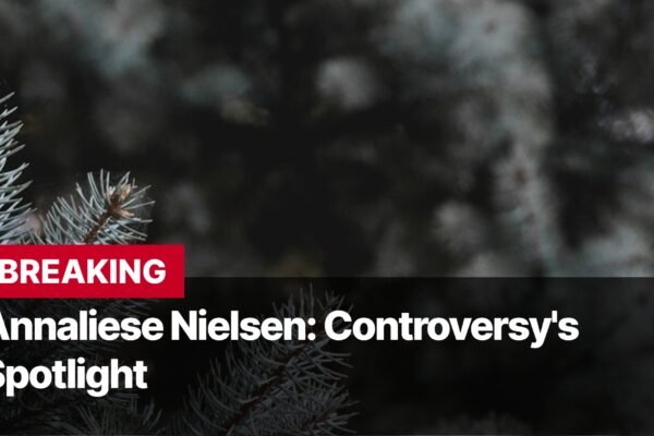 Photo by Capitalist Money on September 14, 2024. May be an image of A close-up image of pine tree branches. The background is dark, and the image is dominated by the branches, with the text 'BREAKING' in red at the top, and 'Annaliese Nielsen: Controversy's Spotlight' in white beneath it. The image may contain text such as 'B', 'R', 'E', 'A', 'K', 'I', 'N', 'G', ' ', 'A', 'n', 'n', 'a', 'l', 'i', 'e', 's', 'e', ' ', 'N', 'i', 'e', 'l', 's', 'e', 'n', ':', ' ', 'C', 'o', 'n', 't', 'r', 'o', 'v', 'e', 'r', 's', 'y', ''', 's', ' ', 'S', 'p', 'o', 't', 'l', 'i', 'g', 'h', 't'.