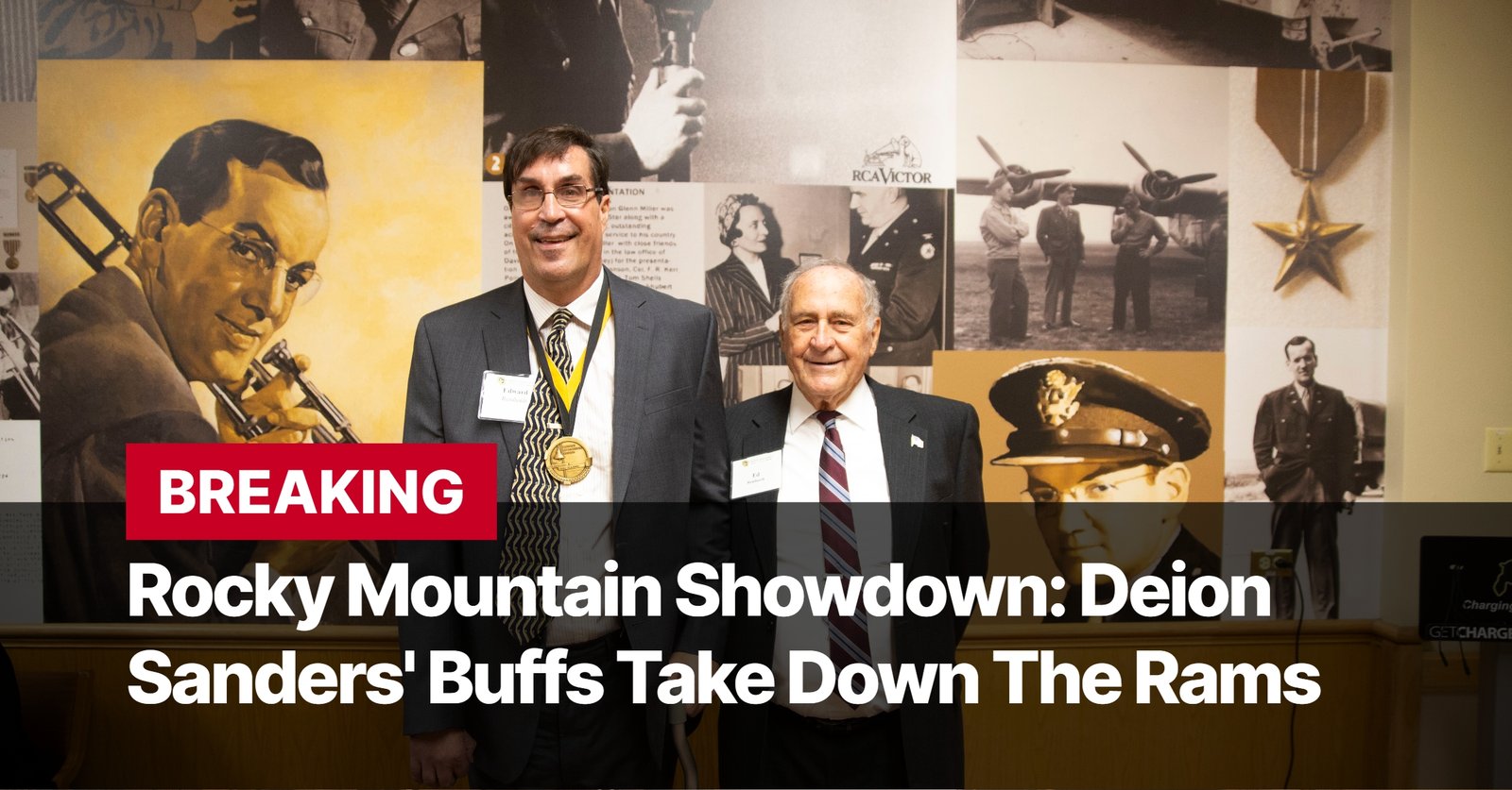 Photo by Capitalist Money on September 15, 2024. May be an image of Two men in suits stand in front of a wall covered in historical photos and posters. The men are both smiling and looking at the camera. The man on the left is wearing a yellow and black striped tie and a gold medal. The man on the right is wearing a blue and white striped tie. The image may contain text such as 'BREAKING Rocky Mountain Showdown: Deion Sanders' Buffs Take Down The Rams'.