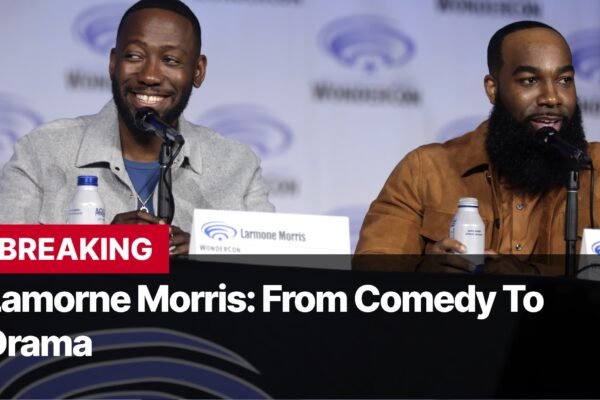 Photo by Capitalist Money on September 16, 2024. May be an image of Actor Lamorne Morris sits at a table during an interview at WonderCon 2019. The image may contain text such as 'BREAKING', 'Larmone Morris: From Comedy To Drama', 'Larmone Morris', 'WONDERCON', 'T Murphy', 'WONDERCON'.