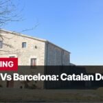 Photo by Capitalist Money on September 16, 2024. May be an image of A stone building with a tiled roof sits in a rural setting. The sky is blue and there are some trees in the background. There is a sign that reads "BREAKING Girona Vs Barcelona: Catalan Derby". The image may contain text such as 'BREAKING', 'Girona Vs Barcelona: Catalan Derby'.