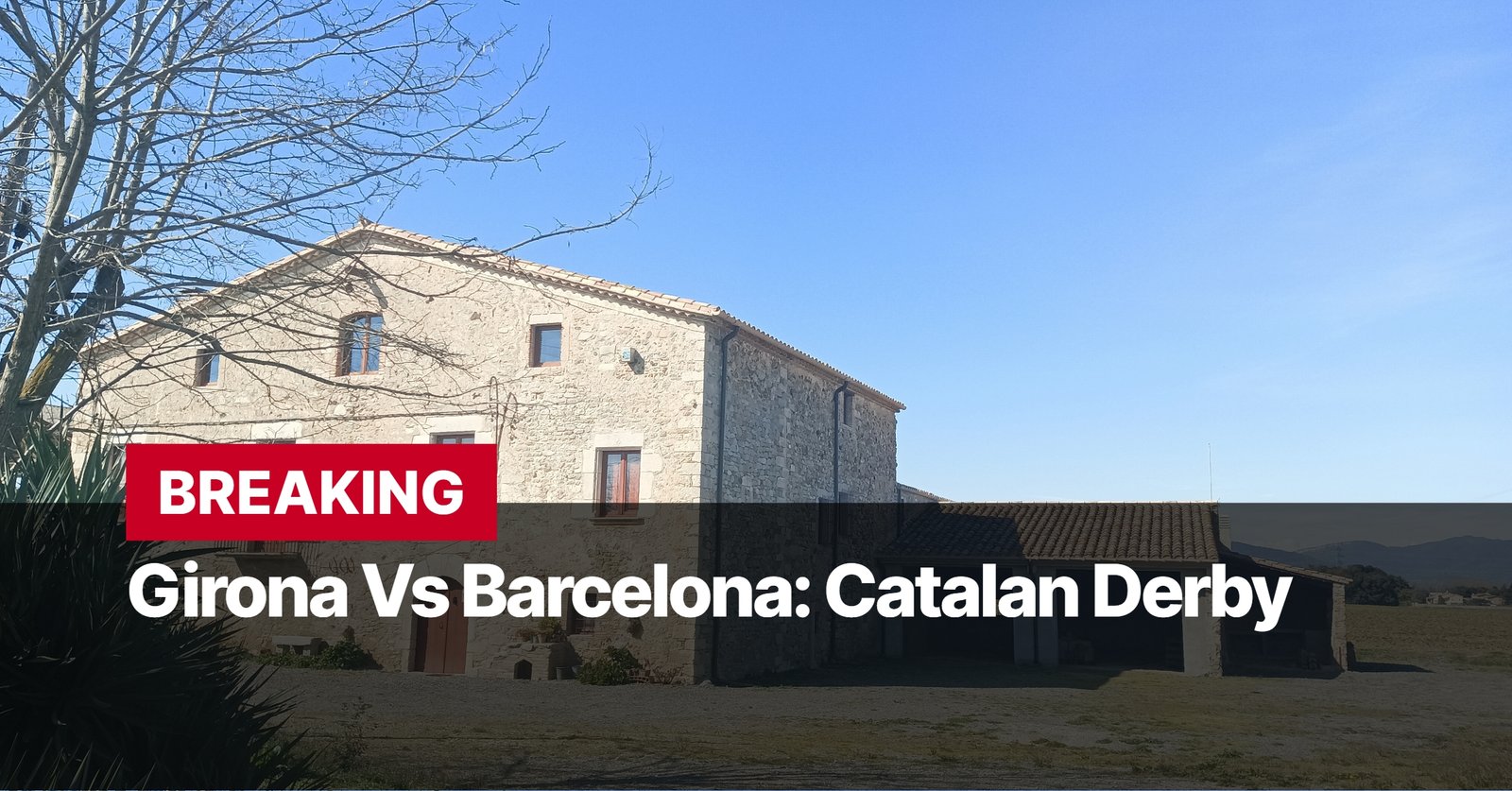 Photo by Capitalist Money on September 16, 2024. May be an image of A stone building with a tiled roof sits in a rural setting. The sky is blue and there are some trees in the background. There is a sign that reads "BREAKING Girona Vs Barcelona: Catalan Derby". The image may contain text such as 'BREAKING', 'Girona Vs Barcelona: Catalan Derby'.