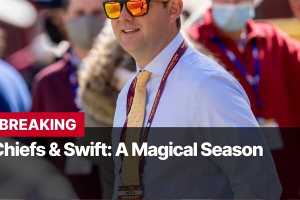 Photo by Capitalist Money on September 16, 2024. May be an image of A man wearing a light blue button-down shirt, a yellow tie, and sunglasses, is standing in a crowd of people. He has a lanyard with his name on it. The image may contain text such as 'BREAKING', 'Chiefs & Swift: A Magical Season'.