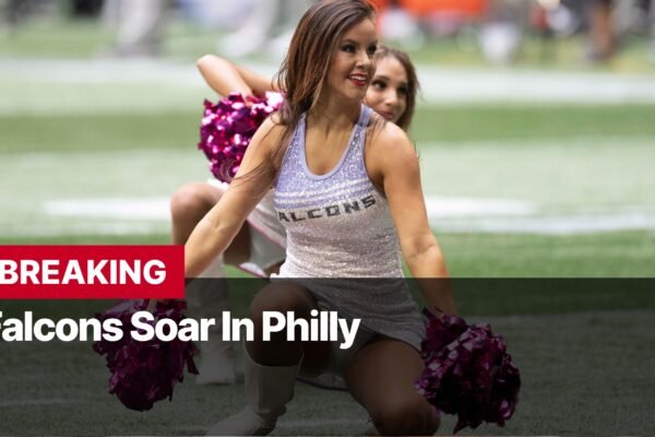 Photo by Capitalist Money on September 17, 2024. May be an image of A cheerleader in a white and purple uniform is kneeling on a football field with a pom-pom in her hand. She is smiling and looking at the camera. The image may contain text such as 'BREAKING Falcons Soar In Philly'.