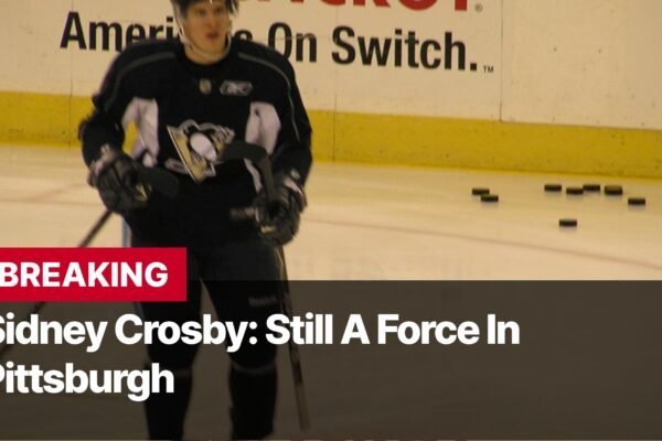 Photo by Capitalist Money on September 17, 2024. May be an image of Sidney Crosby, the captain of the Pittsburgh Penguins, is seen skating on the ice during a practice session. The Penguins have been a successful team in recent years, and Crosby is a key reason for that success. He has won two Stanley Cup championships with the Penguins. The image may contain text such as 'BREAKING', 'Sidney Crosby: Still A Force In', 'Pittsburgh'.