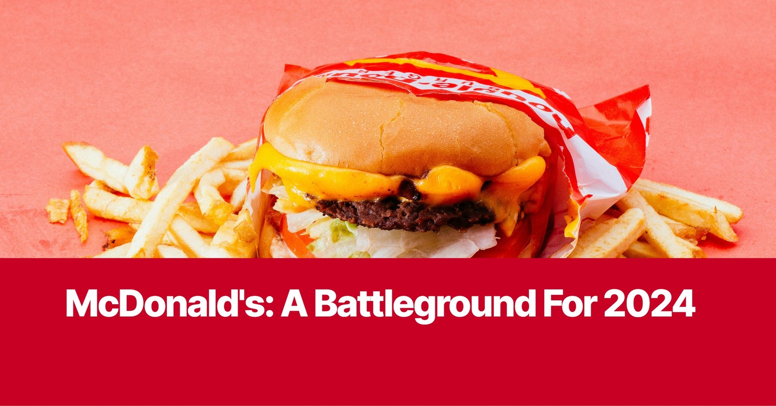 Photo by Capitalist Money on October 21, 2024. May be an image of A close-up shot of a McDonald's cheeseburger and fries on a red background. The burger is wrapped in a red and white paper with the word 