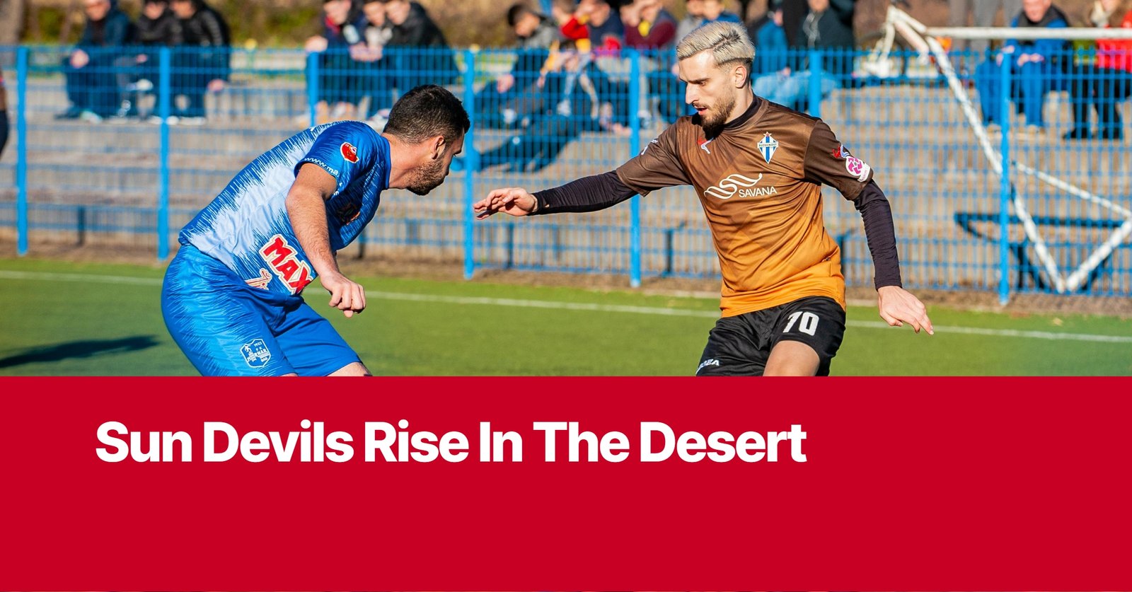 Photo by Capitalist Money on October 12, 2024. May be an image of Two soccer players compete on the field, one in a blue and orange jersey, the other in a brown and blue jersey. The image may contain text such as 'Sun Devils Rise In The Desert'.