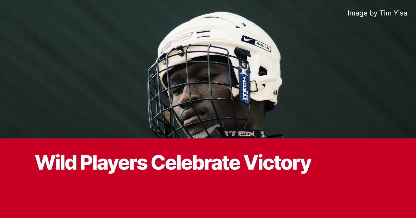 Photo by Capitalist Money on November 02, 2024. May be an image of A hockey player in a white helmet with a cage and black neck guard looks off to the side with a stoic expression. The image may contain text such as 'Wild Players Celebrate Victory', 'Image by Tim Yisa'.