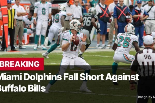 Photo by Capitalist Money on November 04, 2024. May be an image of A Miami Dolphins player prepares to throw the football during a game against the Buffalo Bills. The Bills appear to be winning. The image also features a referee wearing a black and white striped jersey. The image may contain text such as 'BREAKING Miami Dolphins Fall Short Against Buffalo Bills Image by Moe Epsilon'.