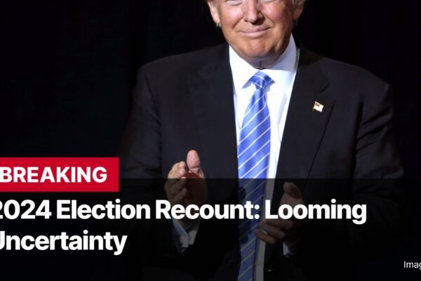 Photo by Capitalist Money on November 07, 2024. May be an image of The image shows Donald Trump, former president of the US, giving a speech with a serious expression on his face. He's wearing a dark suit and blue tie. There's a red headline across the image that reads "BREAKING 2024 Election Recount: Looming Uncertainty". The image may contain text such as 'BREAKING', '2024 Election Recount: Looming Uncertainty', 'Image by A947'.