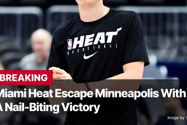 Photo by Capitalist Money on November 11, 2024. May be an image of A Miami Heat player wearing a black jersey with the team logo on the front and a white Nike swoosh underneath. The player is in a basketball arena. The text "BREAKING" is in red on a black background. The text "Miami Heat Escape Minneapolis With A Nail-Biting Victory" is in white on a black background. The image may contain text such as 'BREAKING', 'Miami Heat Escape Minneapolis With', 'A Nail-Biting Victory', 'Image by Sportzeditz'.