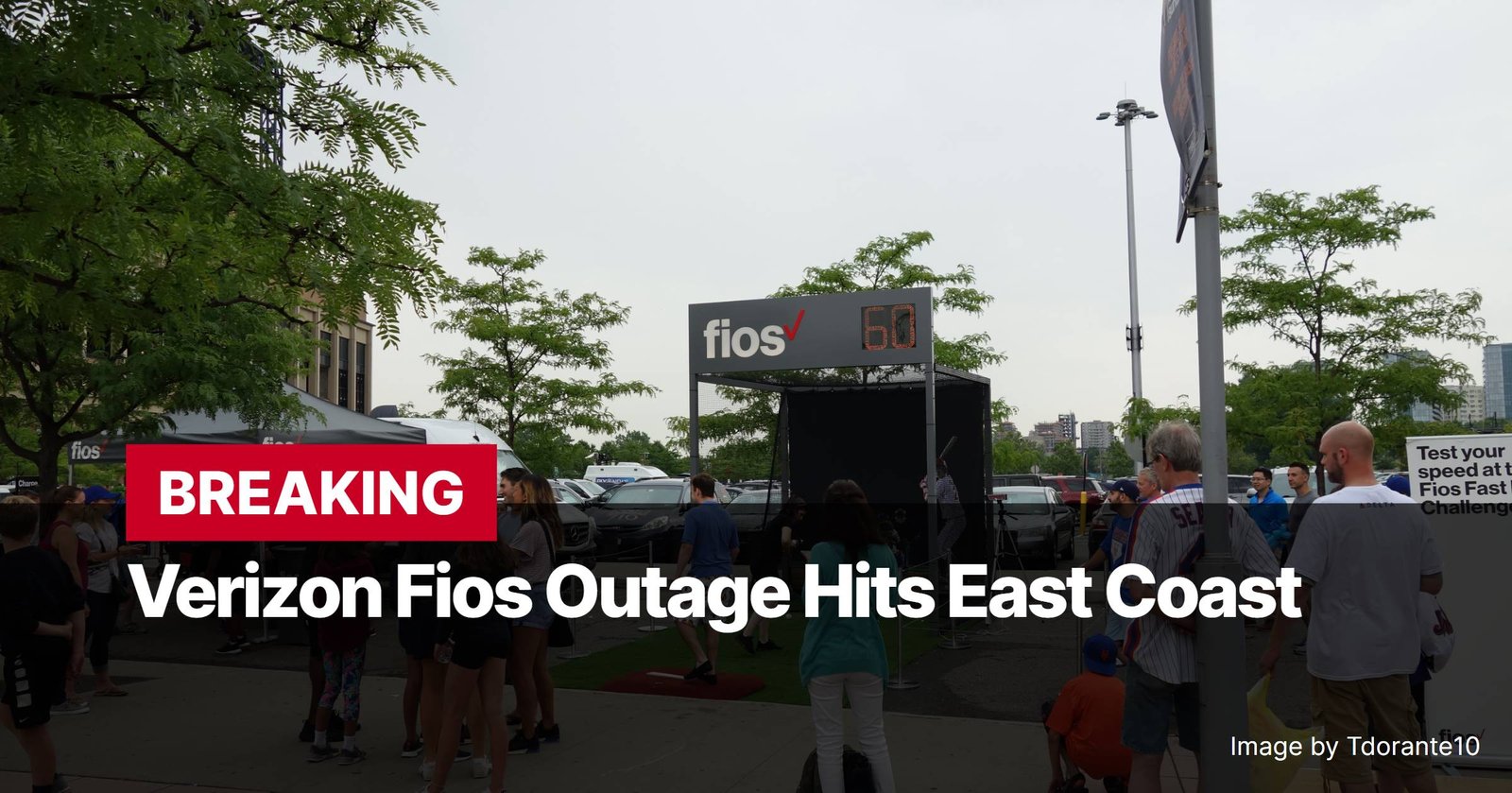 Photo by Capitalist Money on November 12, 2024. May be an image of A photo of a large sign that says "Verizon Fios Outage Hits East Coast" with a crowd of people standing around it in a parking lot. The image may contain text such as 'BREAKING', 'Verizon Fios Outage Hits East Coast', 'Test your speed at the Fios Fastball Challenge', 'Image by Tdorante10', 'fios'.