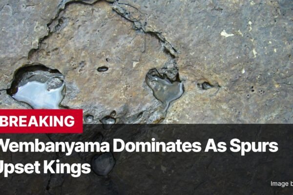 Photo by Capitalist Money on November 12, 2024. May be an image of A close-up image of a rock with a headline in front of it that reads, "Wembanyama Dominates As Spurs Upset Kings." The image may contain text such as 'B', 'R', 'E', 'A', 'K', 'I', 'N', 'G', ' ', 'W', 'e', 'm', 'b', 'a', 'n', 'y', 'a', 'm', 'a', ' ', 'D', 'o', 'm', 'i', 'n', 'a', 't', 'e', 's', ' ', 'A', 's', ' ', 'S', 'p', 'u', 'r', 's', ' ', 'U', 'p', 's', 'e', 't', ' ', 'K', 'i', 'n', 'g', 's', ' ', 'I', 'm', 'a', 'g', 'e', ' ', 'b', 'y', ' ', 'R', 'u', 's', 's', 'a', 'v', 'i', 'a'.