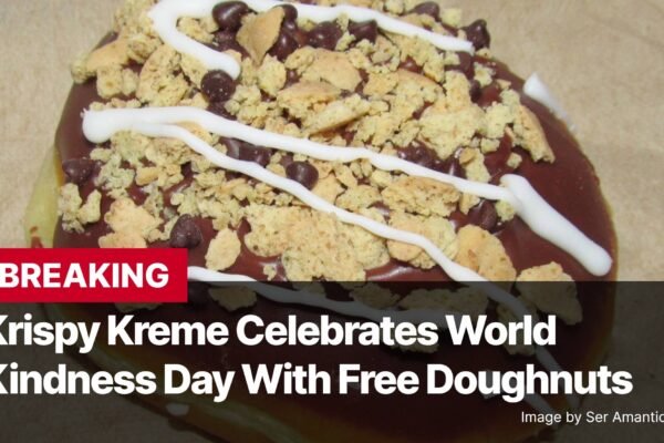 Photo by Capitalist Money on November 13, 2024. May be an image of A close-up of a Krispy Kreme donut covered in chocolate, white icing, and cookie crumbles. The image may contain text such as 'BREAKING Krispy Kreme Celebrates World Kindness Day With Free Doughnuts Image by Ser Amantio di Nicolao'.