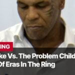 Photo by Capitalist Money on November 13, 2024. May be an image of Mike Tyson is pictured looking down, appearing to be thinking deeply. Text on the image states "Iron Mike Vs. The Problem Child: A Clash of Eras In The Ring." The image may contain text such as 'B', 'R', 'E', 'A', 'K', 'I', 'N', 'G', ' ', 'I', 'r', 'o', 'n', ' ', 'M', 'i', 'k', 'e', ' ', 'V', 's', '.', ' ', 'T', 'h', 'e', ' ', 'P', 'r', 'o', 'b', 'l', 'e', 'm', ' ', 'C', 'h', 'i', 'l', 'd', ':', ' ', 'A', ' ', 'C', 'l', 'a', 's', 'h', ' ', 'O', 'f', ' ', 'E', 'r', 'a', 's', ' ', 'I', 'n', ' ', 'T', 'h', 'e', ' ', 'R', 'i', 'n', 'g', ' ', 'I', 'm', 'a', 'g', 'e', ' ', 'b', 'y', ' ', 'A', 'n', 'i', 'm', 'a', 'l', 'p', 'a', 'r', 't', 'y'.