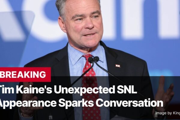 Photo by Capitalist Money on November 04, 2024. May be an image of Tim Kaine, a former US Senator and Vice Presidential candidate, is speaking to a crowd during an event. He is wearing a blue shirt and a red tie. The image may contain text such as 'BREAKING Tim Kaine's Unexpected SNL Appearance Sparks Conversation Image by Kingofthedead'.