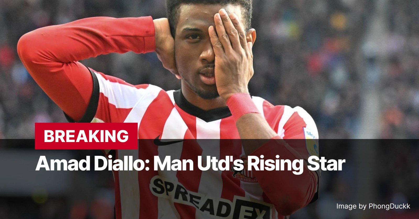 Photo by Capitalist Money on December 16, 2024. May be an image of Amad Diallo, the rising star of Manchester United, is pictured in a red and white striped jersey, his hand covering one eye. The image conveys a sense of contemplation or perhaps disappointment. The image may contain text such as 'BREAKING Amad Diallo: Man Utd's Rising Star Image by PhongDuckk'.